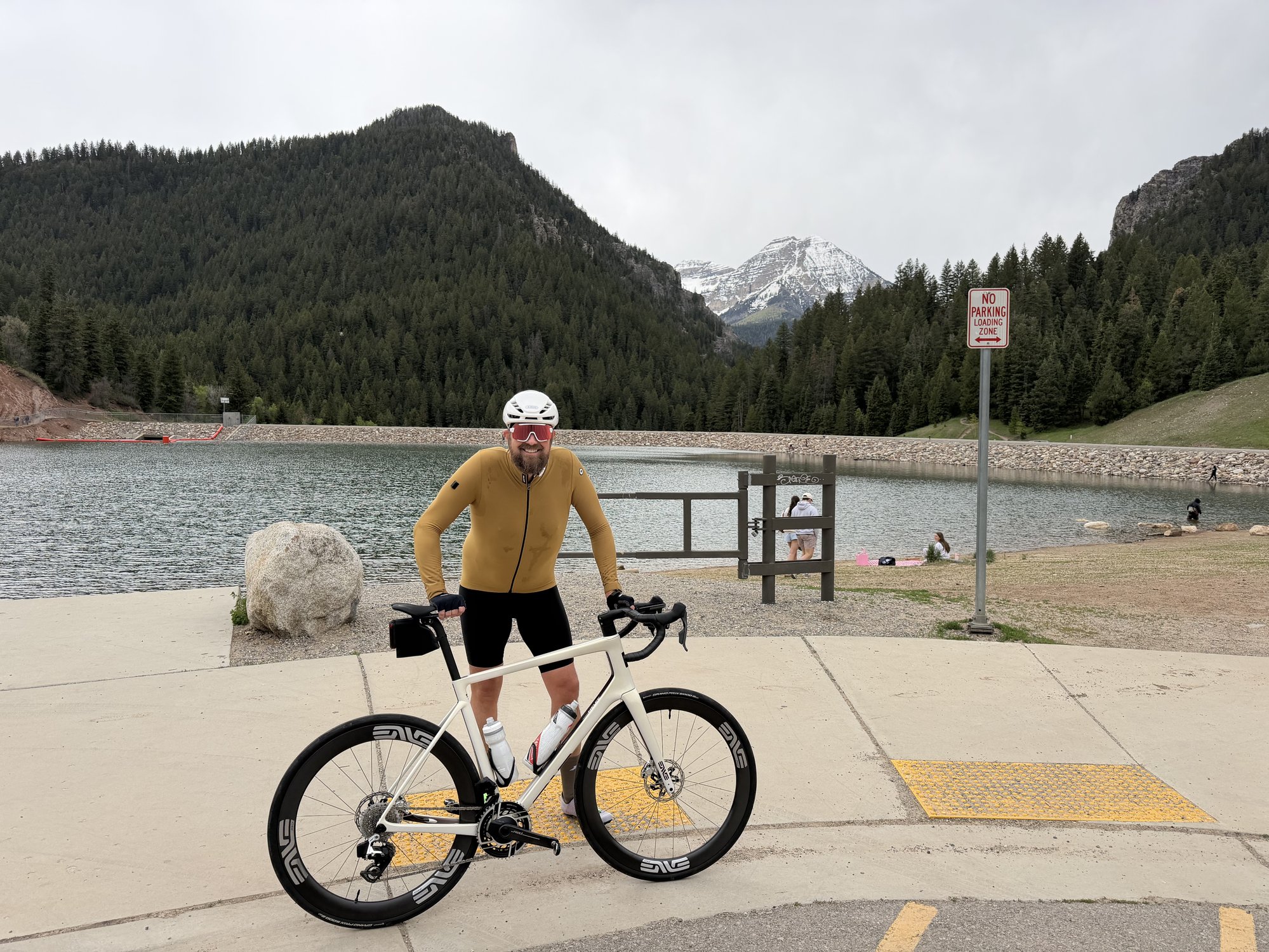 Ryan with ENVE bike at the reservoir with mountains behind