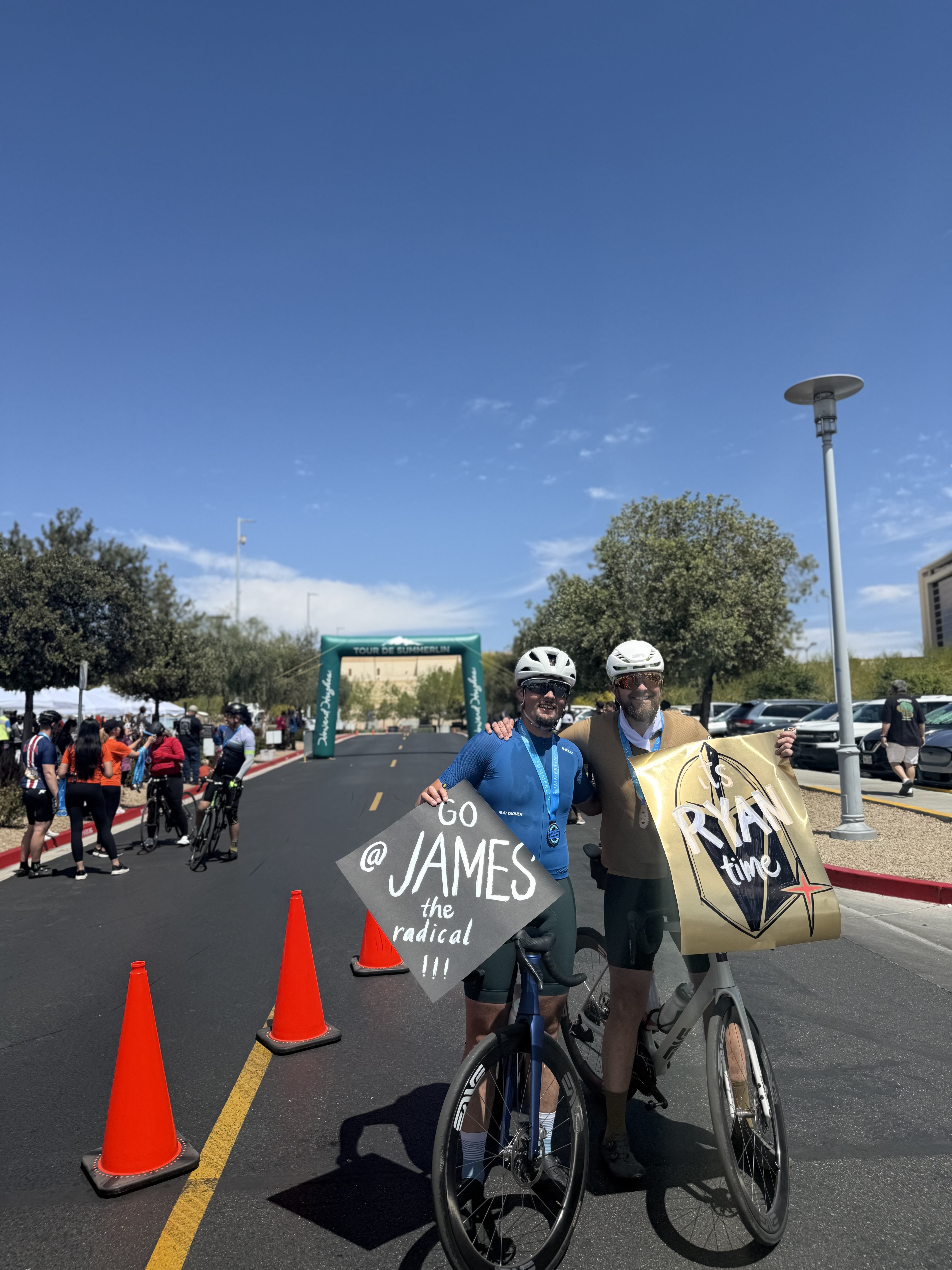 James and Ryan at the finish with signs