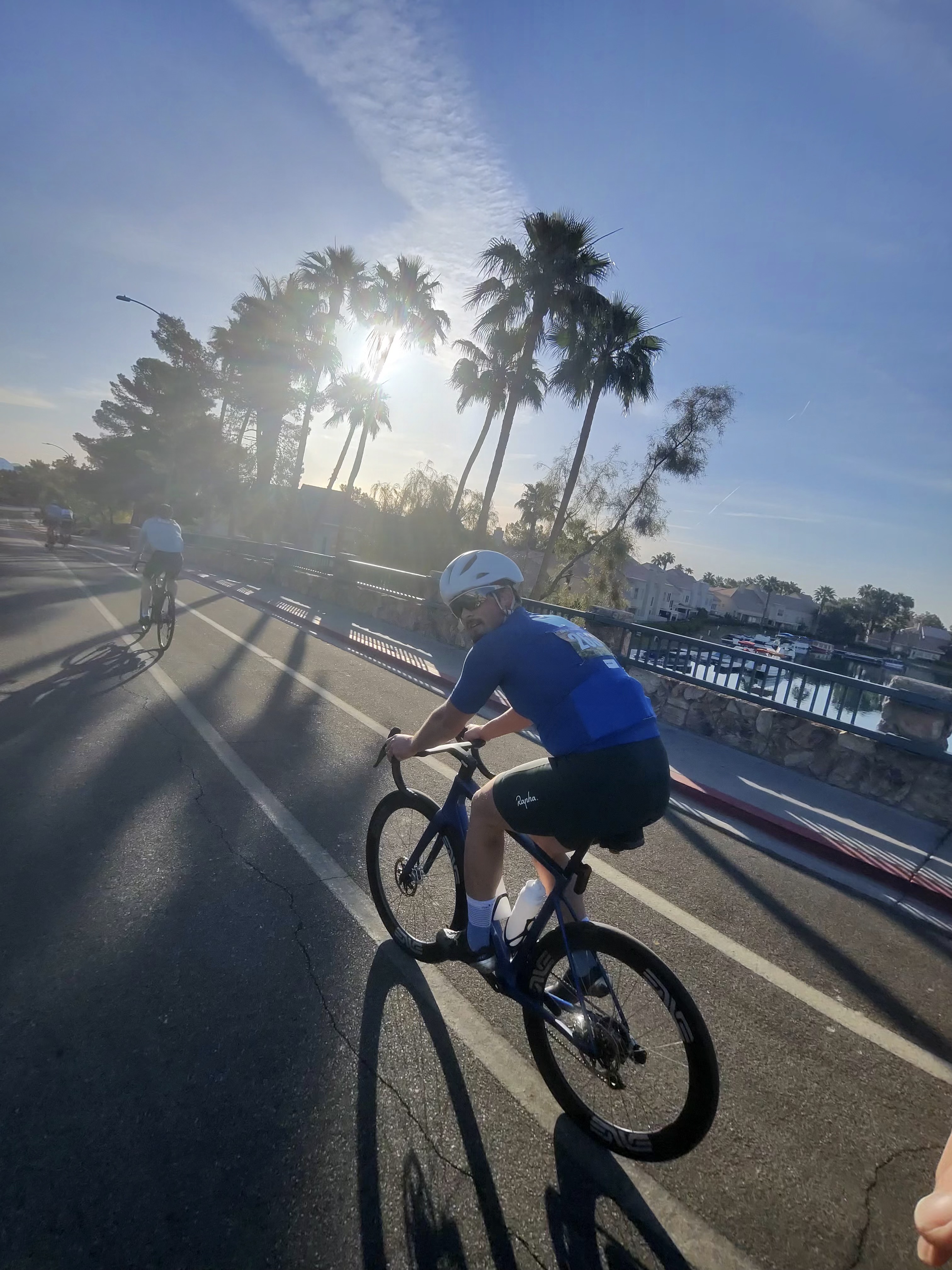 Riding past palm trees at sunrise