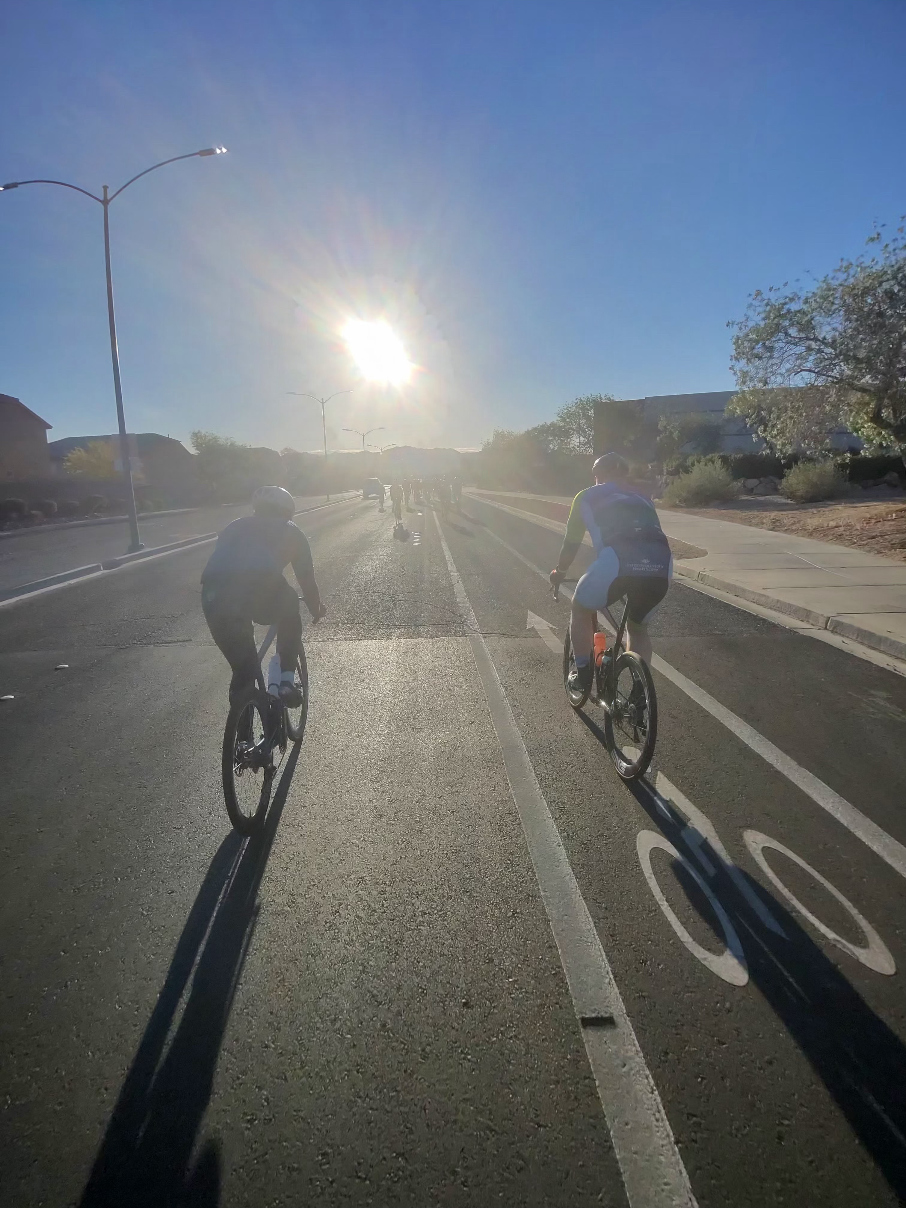 Riders chasing the sunset on a training ride