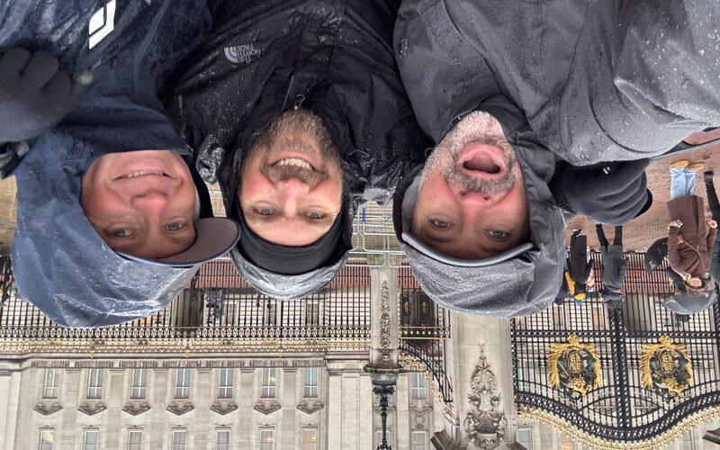 Mick, Ryan and Seth at Buckingham Palace in rain gear